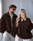 سویشرت زیپدار زنانه و مردانه با آستین خفاشی و تکهدوزی پنلی از جنس دورس کرکدار طوسی