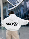 سویشرت زنانه کلاهدار زیپدار با جیب کانگورویی و نوشته Not You در پشت لباس.
